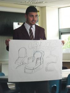 King's-Heath-Boys'-Mathematics-&-Computing-College-pupil-Abid-presents-the-Curve-pregnancy-chair-in-the-‘Dragon’s-Den’-style-challenge.