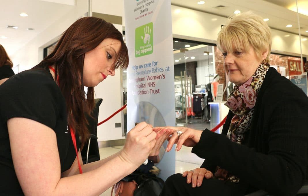 Kim Dalton First in the queue was Kim Dalton from Selly Oak, who enjoyed a manicure by student Claire Barley. Kim, a store assistant at Ponden Mill at the centre, had her nails painted metallic green with green glitter.