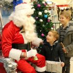 Brothers Charlie and Eddie Allen with Santa at Northfield Shopping Centre